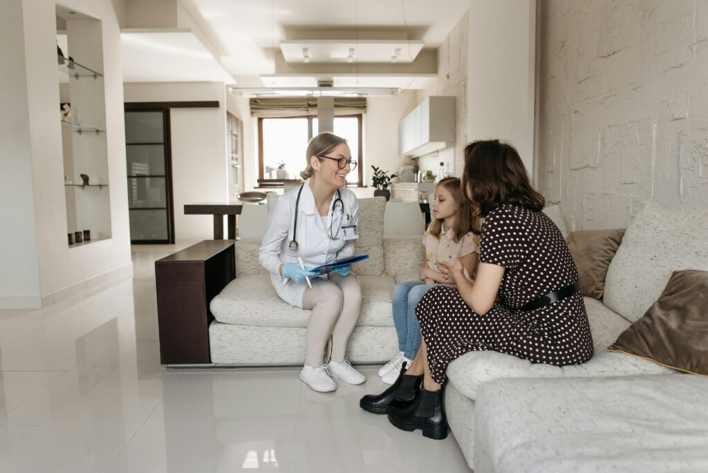 Mother and daughter talking with a doctor