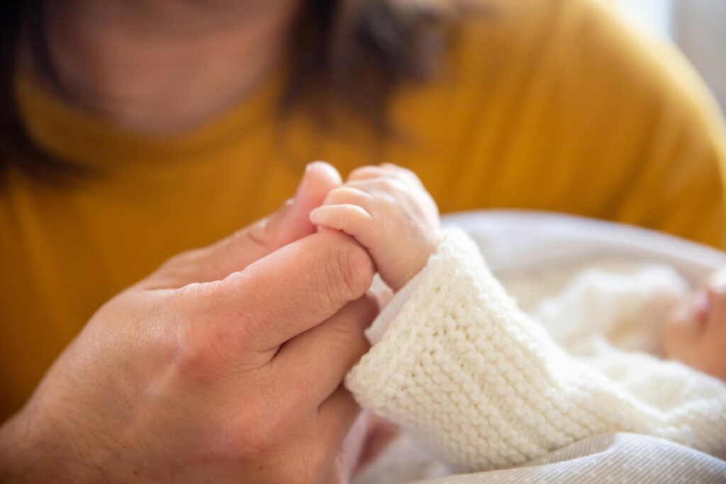 Mom holding baby's hand